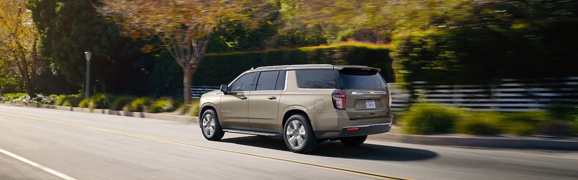 A 2022 Ford Explorer driving along a scenic road.